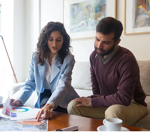 Woman sitting and presenting images to a client to get feedback