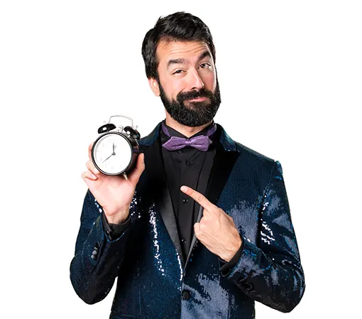 Caucasian man dark blue suit with a table clock on his right hand pointing with his left index finger front view